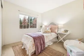 Bedroom #2 with complete with window blinds and soft carpet underfoot.