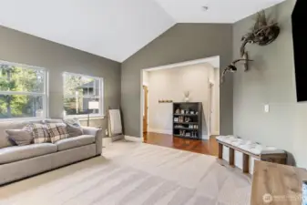 Abundant light in your front living space with vaulted ceilings