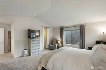 Primary suite with vaulted ceilings