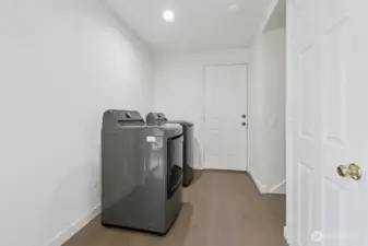 Laundry area. Storage area at right side closet