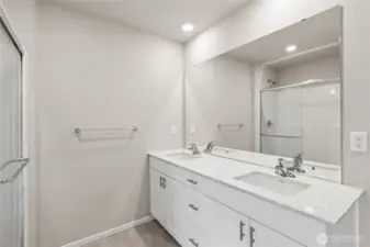 Well-appointed primary bathroom with modern finishes.