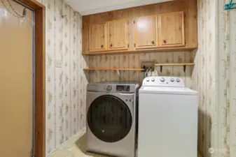 Utility room with full size washer and dryer included.   Door to back patio.