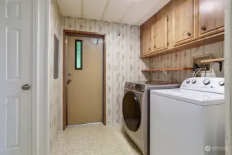 Utility room with full size washer and dryer included.   Door to back patio.