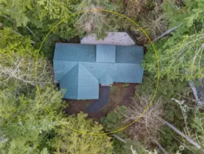 Overhead shot shows metal roof and large private deck.