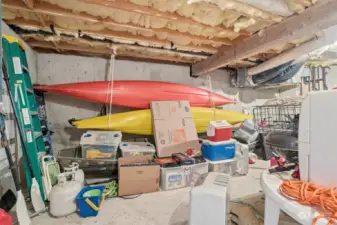 Partial basement w/exterior entry has ample room for kayaks, bikes, etc.  Water heater is here.