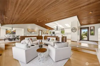 Vaulted, cedar ceilings in the great room, with KentWood Oak Sanderson, wide plank brushed, engineered, FSC  certified flooring.