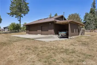 Across the lawn in front of the home, and through the gate is a 1440 square foot shop/barn/garage with toms of space to park toys, with RV parking, too!