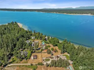 An aerial view of the entirety of the estate, with the large shop/garage/barn in the foreground and the home marked above.