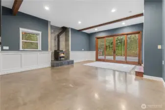 Main level Possible MIL apartment family room with cozy fireplace and chair molding, no stairs.