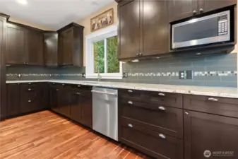 Custom cabinets with granite counters with great countertop space.