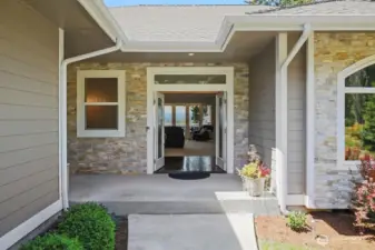 The stacked stone is such an elegant touch and the doors make a statement of beauty.