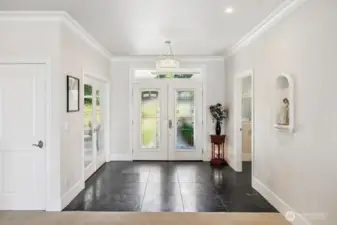 off this entry is a double french door leading to the Den/Office... because it does have a closet...this could be a 3rd bedroom if needed.  This home is on Sewer so there are not any land useage constraints that septic systems can contain. There is also a powder bath for guests.