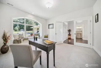 View of the Den/Office off of the Entry. Triple Pane Windows!  View of the front yard to the East.