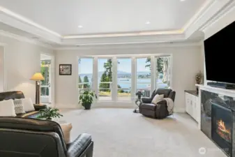 Enjoy the high ceiling with a 'trayed' design which allows for LED lighting.  Upgraded painted trim features throughout the home including 6" - 8" base trim!  This Great Room has a gas fireplace.  Triple Pane Windows offers maximum protection from the sun.