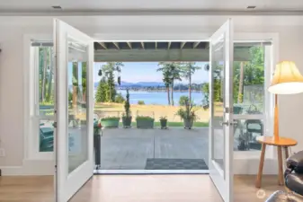 Wow... what an entry to the lower level.  This part of the home has its own driveway, parking areas, covered parking for two cars and a fantastic view from almost every room.  Built with the same style as the Main level... it is easy to see the many ways this space could be used.  A full-time rental? VRBO?  Generational Living?  All the comforts are found here !