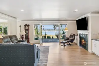 Great Room... open to the Kitchen, Classy Gas Fireplace with built-ins on both sides and a big screen to boot!  Luxury Vinyl Plank, Painted Trim, and flooded with sunlight!