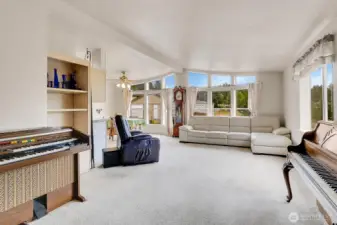 Bright, open bay windows bring in the natural light and highlight the amazing views from the home. * Recliner chair does not convey.
