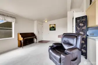 Open entry leads to the spacious living room with plenty of space for additional furnishings. *Recliner Chair does not convey.