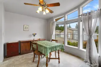 Bright and Cheery dining area with lovely views is conveniently located off of the kitchen.