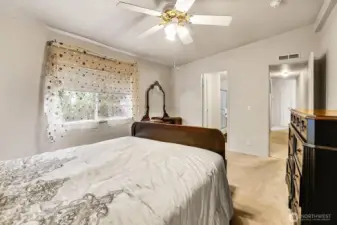 Another view of the large Primary Bedroom with a lovely ceiling fan/light.
