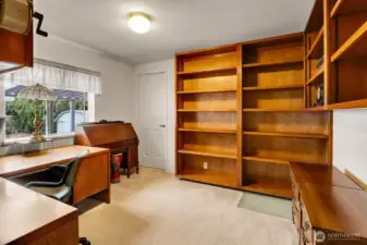 Bedroom #3 is being used as an office but can easily be converted to a bedroom with the large closet. Look at these beautiful built in shelves and bookcase.