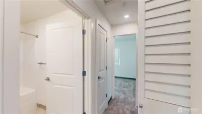 Layout of primary bedroom with ensuite to left and walk in closet