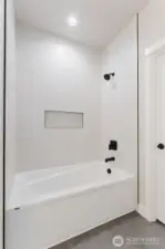 Primary Bathroom large tub and custom tiled shower. Glass door still to come.