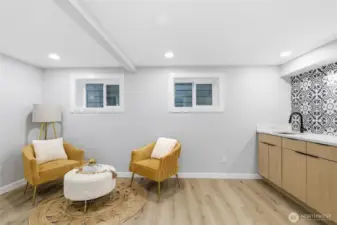 second floor entertaining area with wetbar and windows