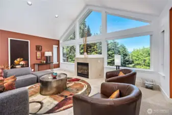 The main living room boasts a wall of clerestory windows, designed to allow natural light into the space. The propane fireplace adds warmth and ambiance in the cooler months. And of course, the views beyond the window is specatular.
