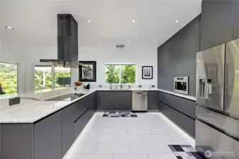 Remodeled kitchen with Futuro Futuro hood, Bosch appliances, Bellmont cabinetry, quartz counters, tile floors, and built-in water filtration—perfect for gourmet cooking.