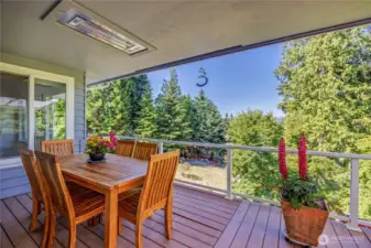 Spacious Trex-style deck with ceiling heaters—perfect for year-round entertaining or relaxing.