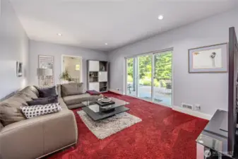 The daylight basement family room is a great place for a media room; game room; or whatever you like. Access to the lower patio is right out the door. And to the left is a pad and electrical outlet for a hot tub if desired.