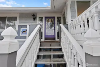 Metal entry steps that are heavy duty and grip for non slip steps which make it very secure to walk up or down. The railings add a nice touch and bring out some charm. Notice the stain glass in the main entry door.