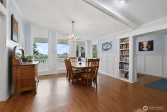 Vaulted ceilings & large windows bringing light into the room is such a nice feature for the dining area. Built in shelves and wood work show the extra touches that you will surely love.
