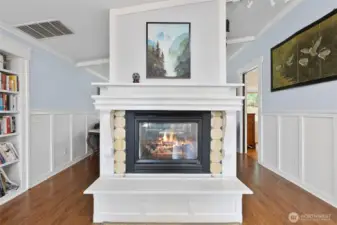 Propane fireplace is double sided. This is from the dining room side. Living room is on the other side.