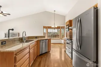 Kitchen with breakfast nook, open to second living area