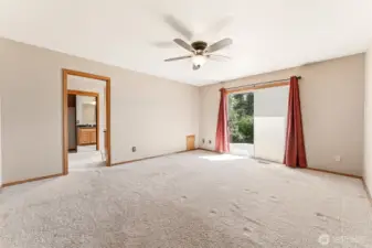 Primary bedroom with slider to backyard