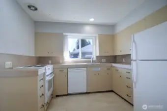 Enough space and windows on either side lets natural light brighten the kitchen