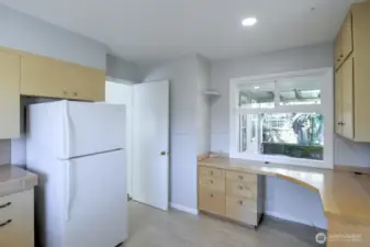 Door to hide the food prep/mess- a common mid-century feature that's making a comeback w/"back kitchens". Space to renovate in many ways.