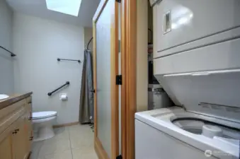 Into bathroom- The stacked washer/dryer included in sale=no laundromat trips!