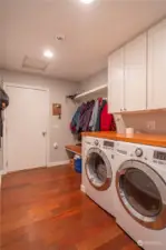 Laundry room with pantry that leads out to garage.