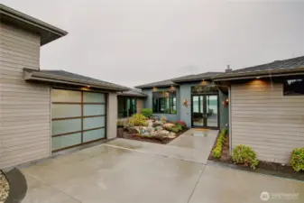 Tranquil waterfall feature welcomes you. Level entry parking garage