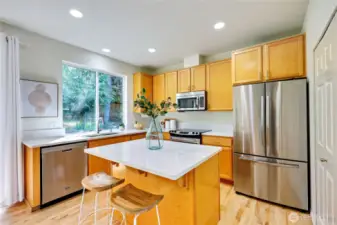 Gorgeous NEW quartz countertops adorn the kitchen and the office alcove. Updated appliances and kitchen sink.