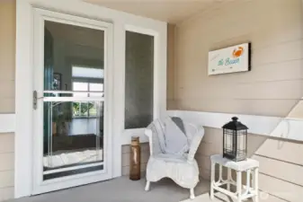 Covered front patio area entry to home.