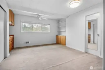 The second bedroom suite includes built-in shelving.