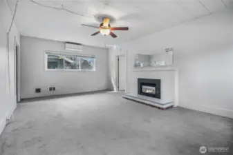 Spacious living room with HP mini-split for heating & cooling.