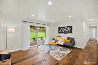 The living room is all about comfort and connection—with sliding doors to the backyard and a cozy setup that invites you to sit down and stay awhile.