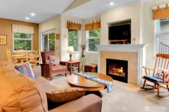 East facing windows with gas fireplace.