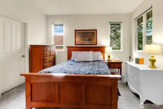 Primary bedroom with North & South facing windows. Large enough for a King Size bed and with walk in closet an private and ensuite bath.