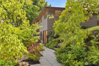 Lush gardens welcome you home.
